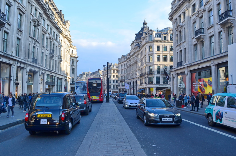 26 - View looking down Regent Street in London, England, featuring classic black cabs and a red double-decker bus